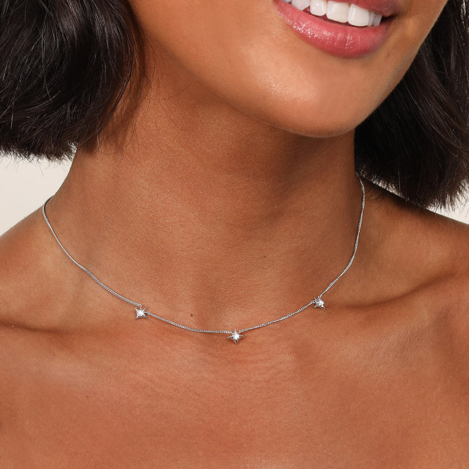 Cosmic Star Charm Necklace in Silver worn